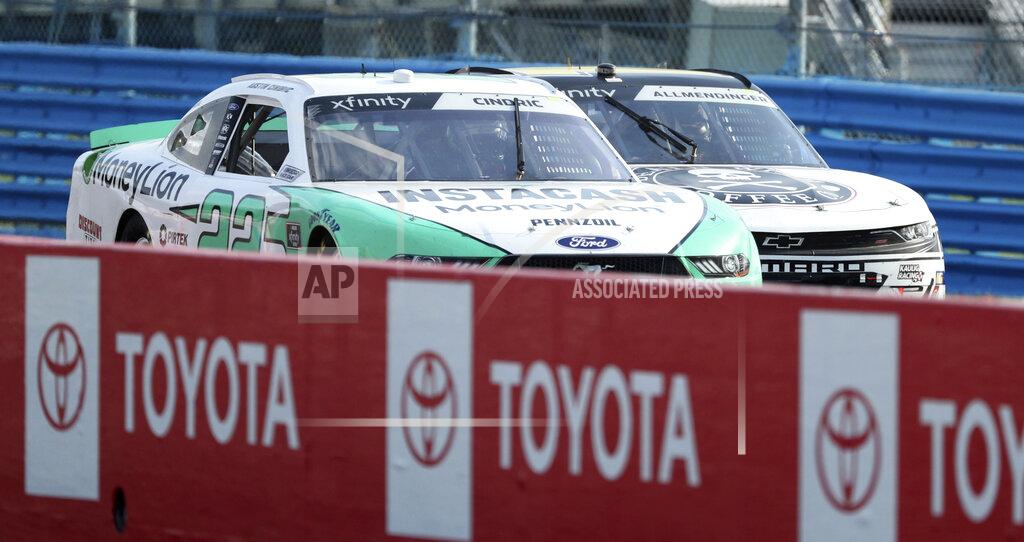 John Munson Austin Cindric (22) passes AJ Allmendinger with one lap to go on his way to victory at the Zippo 200 NASCAR Xfinity Series auto race at Watkins Glen International, Saturday, Aug. 3, 2019, in Watkins Glen, New York. (AP Photo/John Munson)