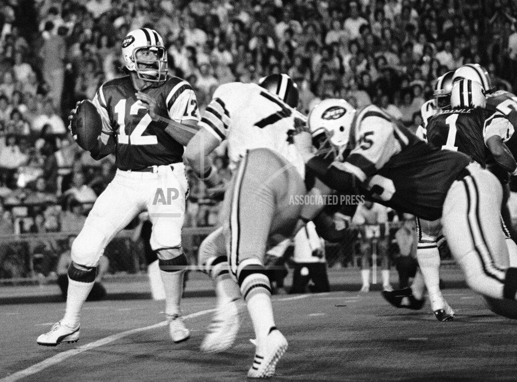 FILE- In this Sept. 2, 1973, file photo, New York Jets' Joe Namath (12) gets set to pass as New Orleans Saints Billy Newsome (78) puts on the pressure and Jets' Winston Hill (75) blocks. Hill was posthumously selected last year for the centennial class of the Pro Football Hall of Fame after a 15-year career. (AP Photo, File)