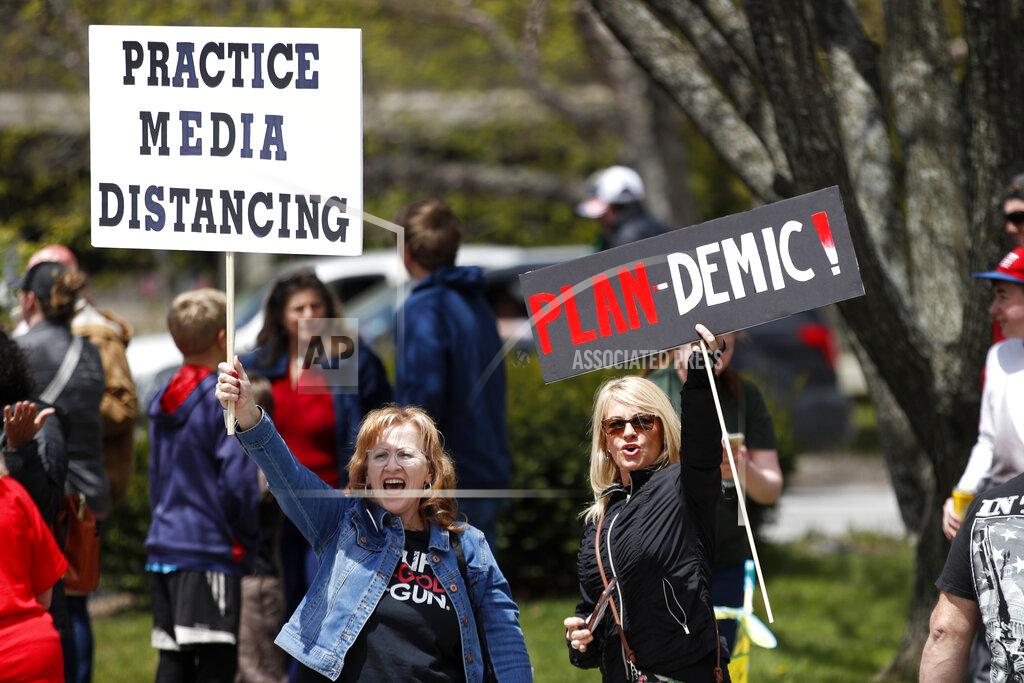 Robert F. Bukaty Protesters rally against the executive orders by Maine Gov. Janet Mills keep some of Maine businesses closed to help prevent the spread of coronavirus, Saturday, May 16, 2020, in Augusta, Maine. (AP Photo/Robert F. Bukaty)