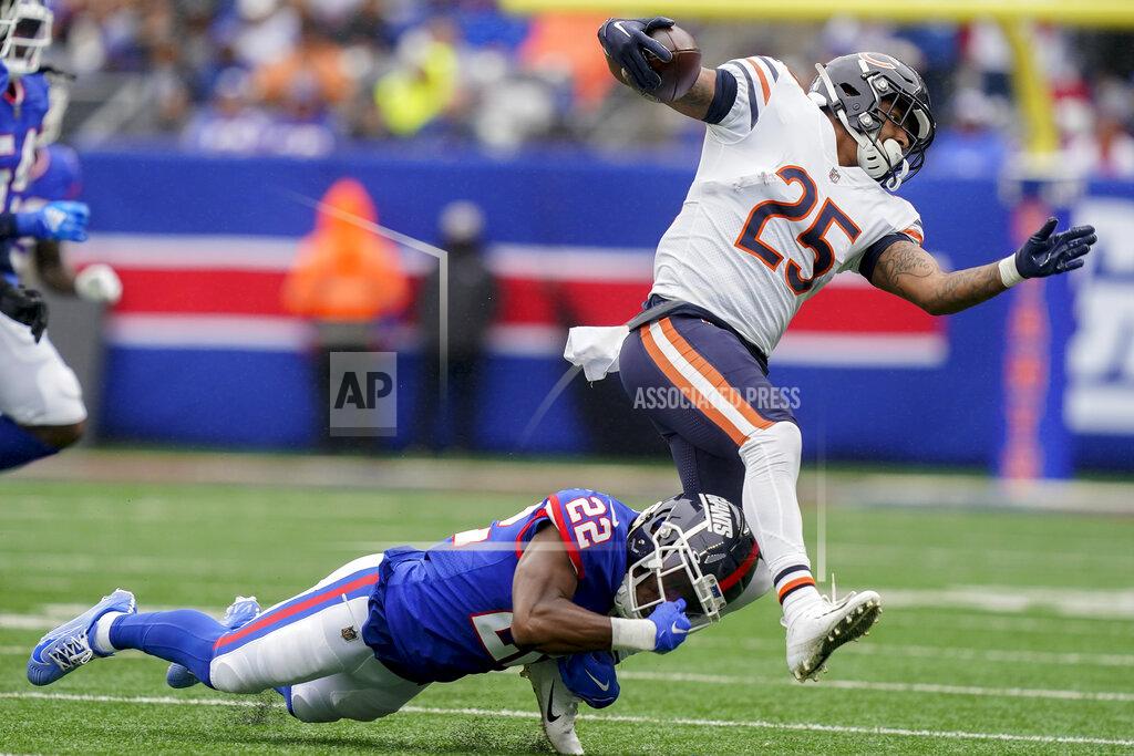 John Minchillo New York Giants cornerback Adoree' Jackson (22) trips up Chicago Bears running back Trestan Ebner (25) during the third quarter of an NFL football game, Sunday, Oct. 2, 2022, in East Rutherford, N.J. (AP Photo/John Minchillo)