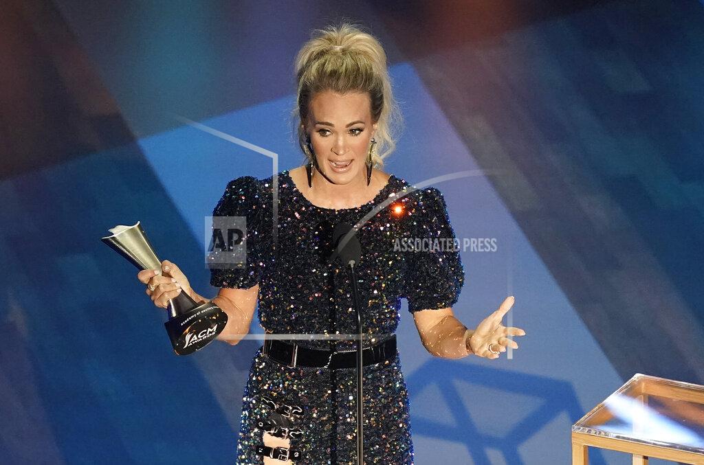 Mark Humphrey Carrie Underwood accepts the entertainer of the year award in a tie with Thomas Rhett during the 55th annual Academy of Country Music Awards at the Grand Ole Opry House on Wednesday, Sept. 16, 2020, in Nashville, Tenn. (AP Photo/Mark Humphrey)
