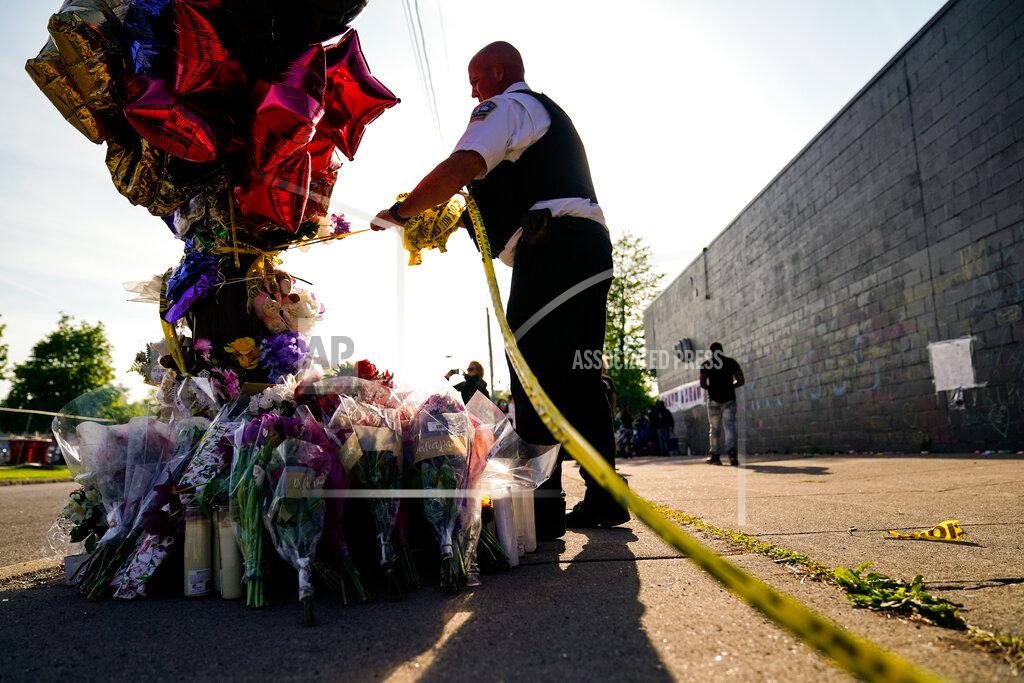 Matt Rourke A police officer removes tape from scene of Saturday's shooting at a supermarket, in Buffalo, Thursday, May 19, 2022. (AP Photo/Matt Rourke)
