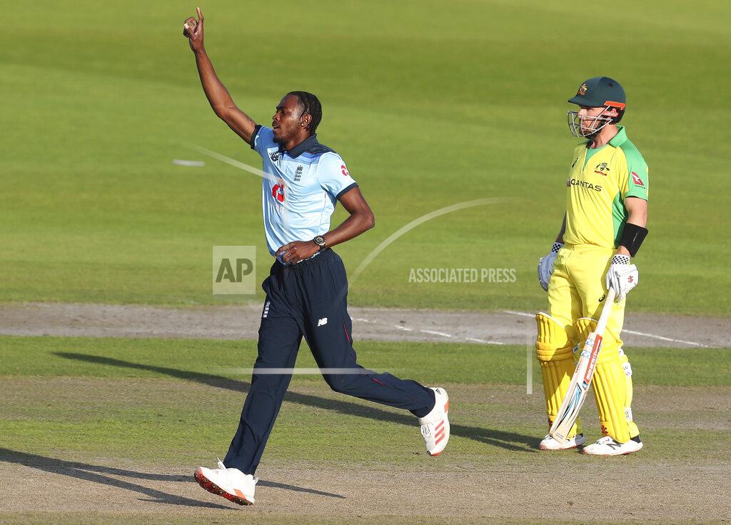 Martin Rickett England's Jofra Archer celebrates the dismissal of Australia's David Warner during the second ODI cricket match between England and Australia, at Old Trafford in Manchester, England, Sunday, Sept. 13, 2020. (Martin Rickett/Pool via AP)