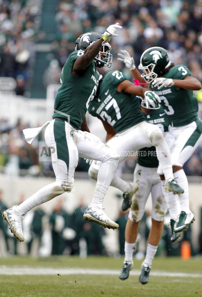Al Goldis Michigan State's David Dowell, left, Khari Willis (27) and Xavier Henderson (3) celebrate a stop and a turnover on downs against Purdue during the fourth quarter of an NCAA college football game, Saturday, Oct. 27, 2018, in East Lansing, Mich. Michigan State won 23-13. (AP Photo/Al Goldis)