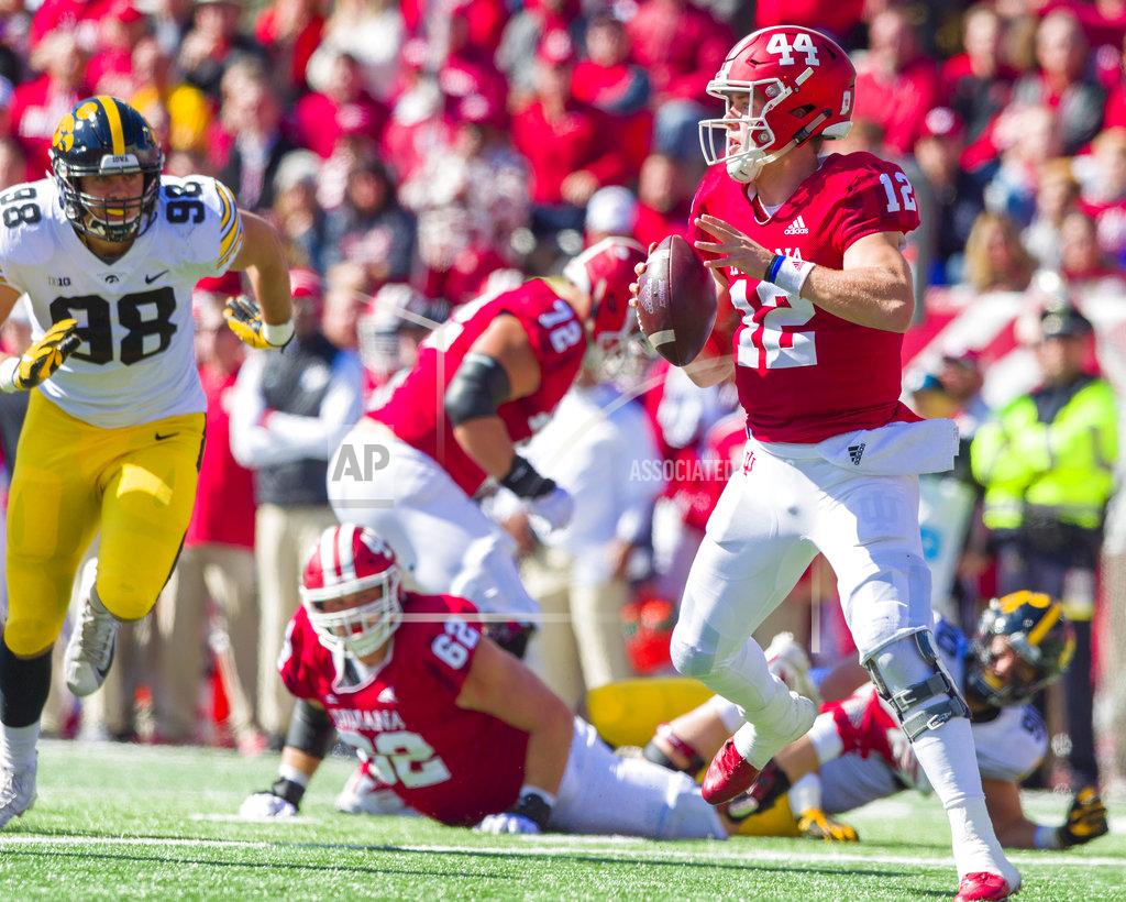 Doug Mcschooler Indiana quarterback Peyton Ramsey (12) scrambles in the backfield as he looks for an open receiver during the first half of an NCAA college football game against Iowa, Saturday, Oct. 13, 2018, in Bloomington, Ind. (AP Photo/Doug McSchooler)