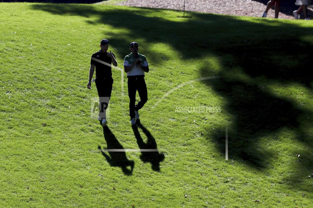 Curtis Compton Danny Willett, left, and Rickie Fowler walk down the 6th fairway during the second round of the Masters Friday, Nov. 13, 2020, in Augusta, Ga. (Curtis Compton/Atlanta Journal-Constitution via AP)