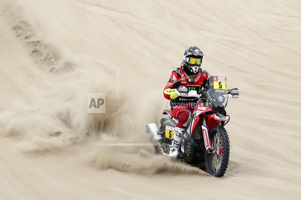 Ricardo Mazalan Joan Barreda of Spain rides his Honda motorbike during the first stage of the Dakar Rally between Lima and Pisco, Peru, Monday, Jan. 7, 2019. (AP Photo/Ricardo Mazalan)