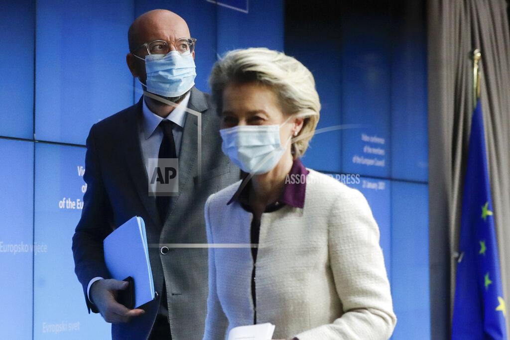 Olivier Hoslet European Council President Charles Michel, left, and European Commission President Ursula von der Leyen leave after a joint news conference at the end of a EU summit video conference at the European Council headquarters in Brussels, Thursday, Jan. 21, 2021. European Union leaders assessed more measures to counter the spread of coronavirus variants during a video summit Thursday as the bloc's top disease control official said urgent action was needed to stave off a new wave of hospitalizations and deaths. (Olivier Hoslet, Pool Photo via AP)