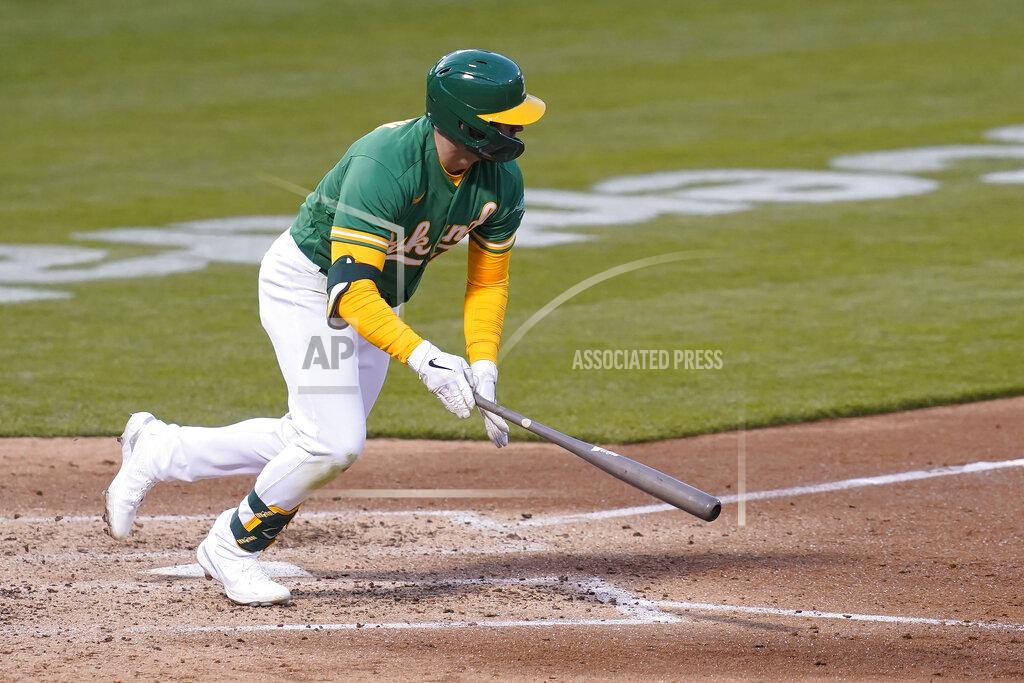 Jeff Chiu Oakland Athletics' Seth Brown hits a run-scoring single against the Minnesota Twins during the fourth inning of the second baseball game of a doubleheader in Oakland, Calif., Tuesday, April 20, 2021. (AP Photo/Jeff Chiu)