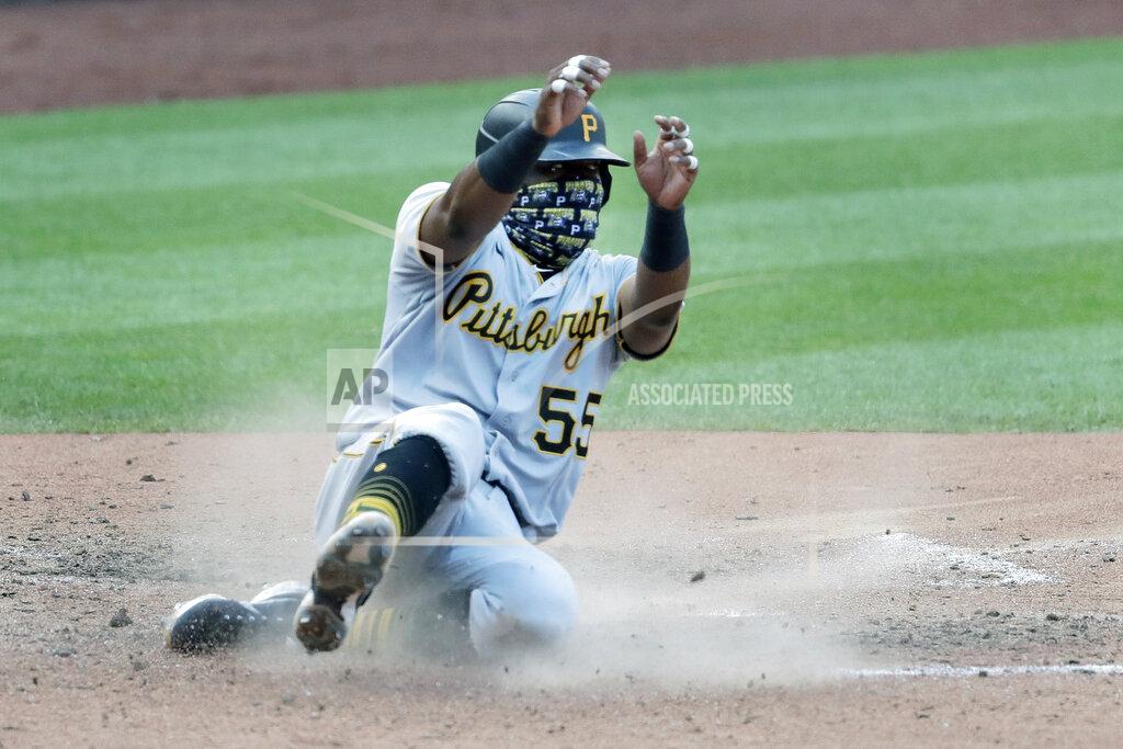 Jeff Roberson Pittsburgh Pirates' Josh Bell scores during the eighth inning of a baseball game against the St. Louis Cardinals Sunday, July 26, 2020, in St. Louis. (AP Photo/Jeff Roberson)