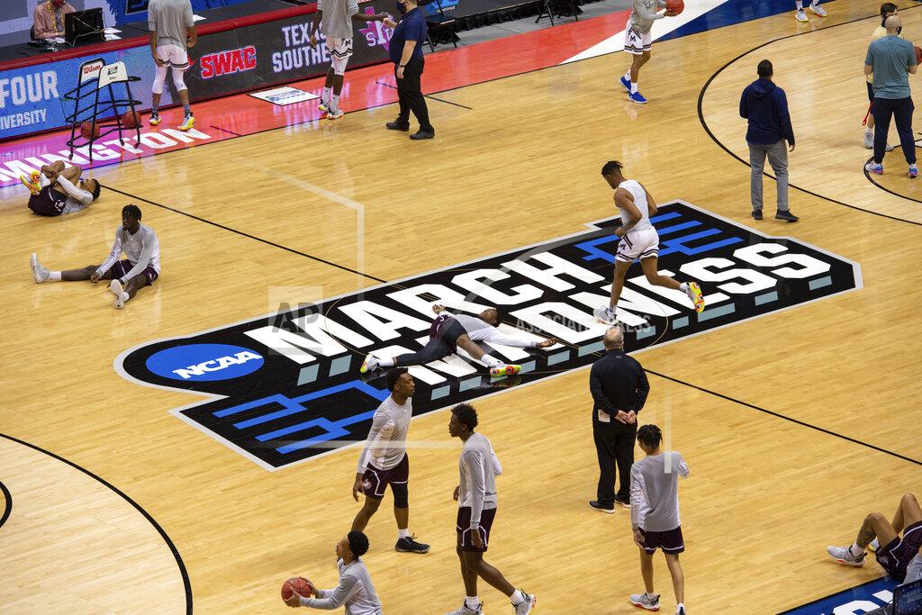 Doug Mcschooler Players warm up on the court before the start of a First Four game between Texas Southern and Mount St. Mary's in the NCAA men's college basketball tournament, Thursday, March 18, 2021, in Bloomington, Ind. (AP Photo/Doug McSchooler)