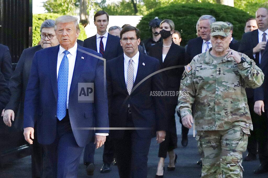 FILE - In this June 1, 2020, file photo, President Donald Trump departs the White House to visit outside St. John's Church, in Washington. Walking behind Trump from left are, Attorney General William Barr, Secretary of Defense Mark Esper and Gen. Mark Milley, chairman of the Joint Chiefs of Staff. (AP Photo/Patrick Semansky, File)