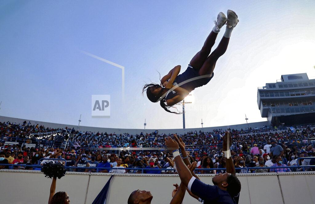 Patrick Lantrip Jackson State cheerleader Essence Rentie gets tossed up in the air before the Southern Heritage Classic NCAA college football game against Tennessee State in Memphis, Tenn., Saturday, Sept. 11, 2021. (Patrick Lantrip/Daily Memphian via AP)