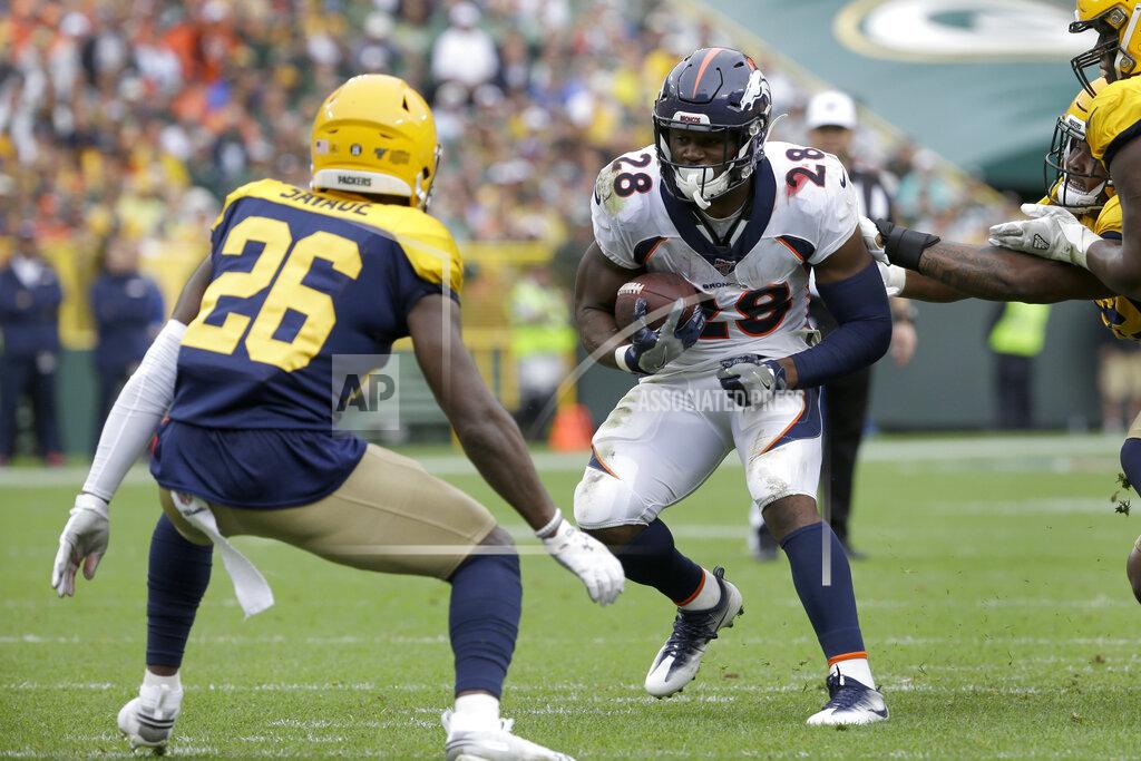 Mike Roemer Denver Broncos running back Royce Freeman (28) runs with the ball as Green Bay Packers defensive back Darnell Savage (26) defends during the first half of an NFL football game Sunday, Sept. 22, 2019, in Green Bay, Wis. (AP Photo/Mike Roemer)