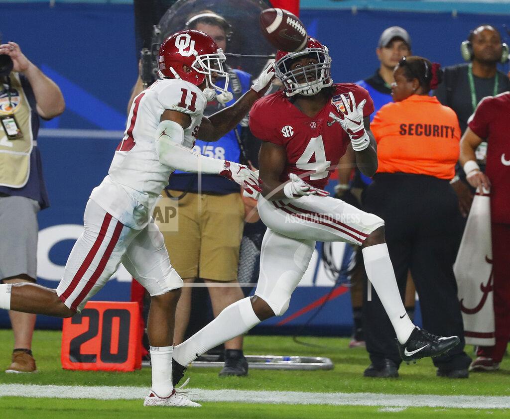 Wilfredo Lee Alabama wide receiver Jerry Jeudy (4) eyes a pass as Oklahoma cornerback Parnell Motley (11) attempts to defend, during the second half of the Orange Bowl NCAA college football game, Saturday, Dec. 29, 2018, in Miami Gardens, Fla. (AP Photo/Wilfredo Lee)