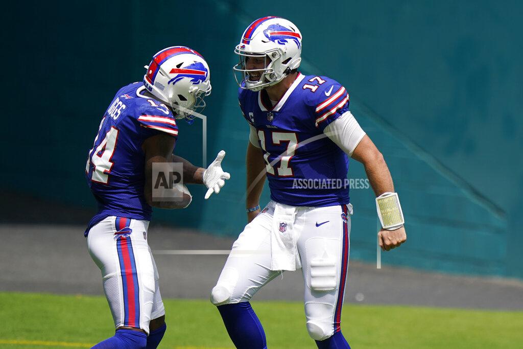 Wilfredo Lee Buffalo Bills quarterback Josh Allen (17) celebrates with wide receiver Stefon Diggs (14) after Diggs scored a touchdown during the first half of an NFL football game against the Miami Dolphins, Sunday, Sept. 20, 2020 in Miami Gardens, Fla. (AP Photo/Wilfredo Lee)