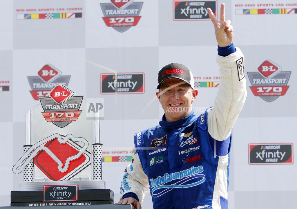 Tom E. Puskar A.J. Allmendinger celebrates in Victory Lane after winning the B&L Transport 170 NASCAR Xfinity Series auto race at Mid-Ohio Sports Car Course on Saturday, June 5, 2021, in Lexington, Ohio. (AP Photo/Tom E. Puskar)