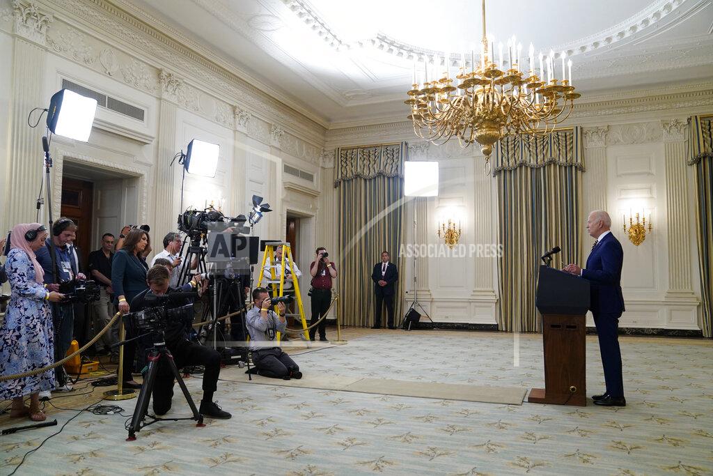 Evan Vucci President Joe Biden speaks about reaching 300 million COVID-19 vaccination shots, in the State Dining Room of the White House, Friday, June 18, 2021, in Washington. (AP Photo/Evan Vucci)