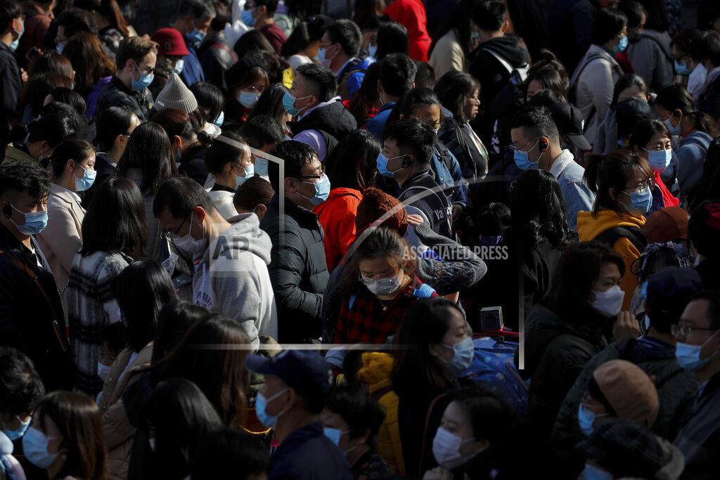 Andy Wong Visitors wearing face masks to help curb the spread of the coronavirus line up to enter an exhibition held at the Forbidden City in Beijing, Saturday, Nov. 7, 2020. China on Saturday reported 33 new confirmed coronavirus infections, all of which the National Health Commission said were in patients who contracted the virus abroad. (AP Photo/Andy Wong)