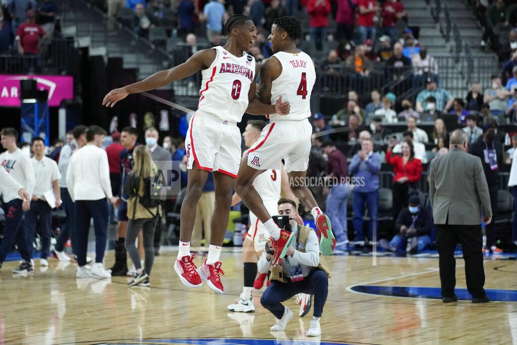 John Locher Arizona's Bennedict Mathurin (0) and Dalen Terry (4) celebrate after Arizona defeated Colorado in an NCAA college basketball game in the semifinal round of the Pac-12 tournament Friday, March 11, 2022, in Las Vegas. (AP Photo/John Locher)