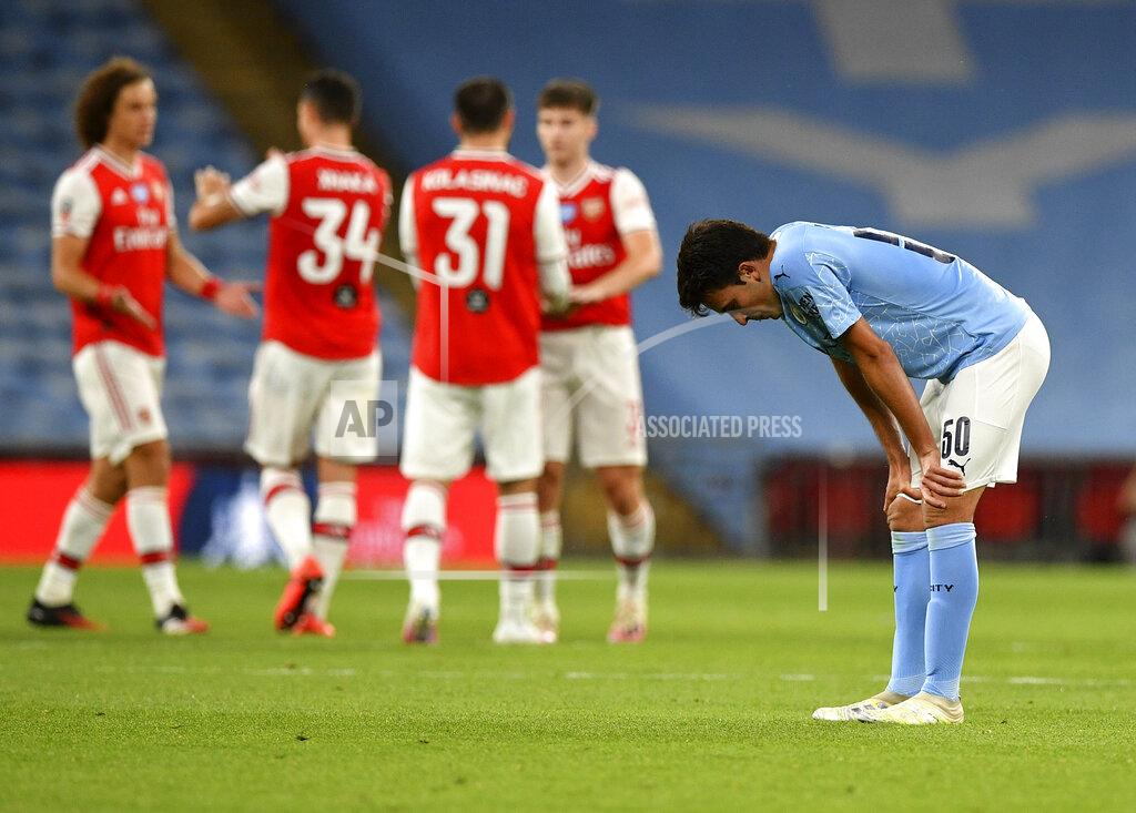 Justin Tallis Manchester City's Eric Garcia reacts after the FA Cup semifinal soccer match between Arsenal and Manchester City at Wembley in London, England, Saturday, July 18, 2020. (AP Photo/Justin Tallis,Pool)