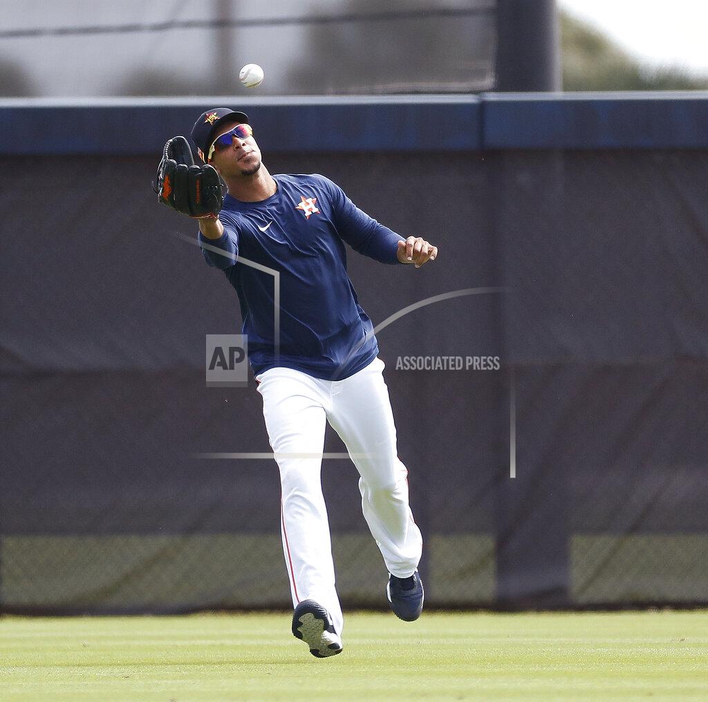 Karen Warren Houston Astros outfielder Michael Brantley catches a ball during baseball spring training in West Palm Beach, Fla., Tuesday, Feb. 23, 2021. (Karen Warren/Houston Chronicle via AP)