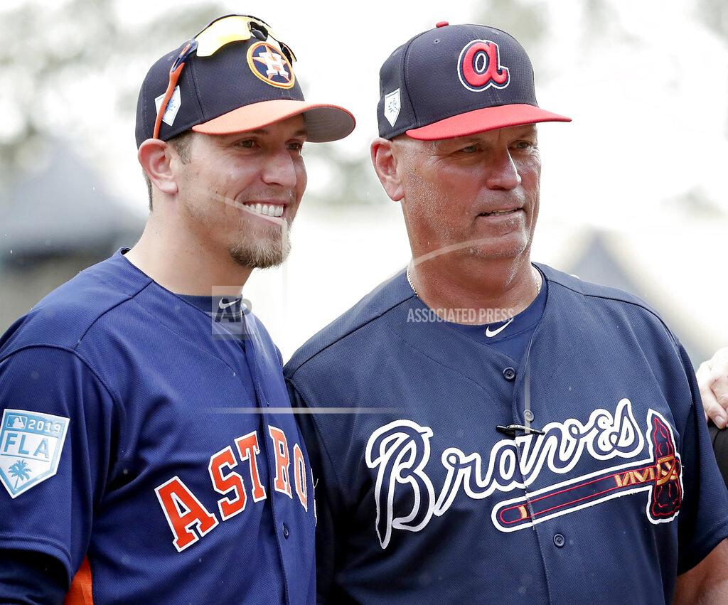 John Raoux FILE- Houston Astros hitting coach Troy Snitker, left, stands with his father Braves manager Brian Snitker before a spring baseball exhibition game, Monday, March 4, 2019, in Kissimmee, Fla. No matter how this year’s World Series ends, a Snitker will get a championship ring. This edition of the Fall Classic is a family affair with Atlanta Braves manager Brian Snitker in the dugout opposite his son, Houston Astros co-hitting coach Troy Snitker. (AP Photo/John Raoux, File)