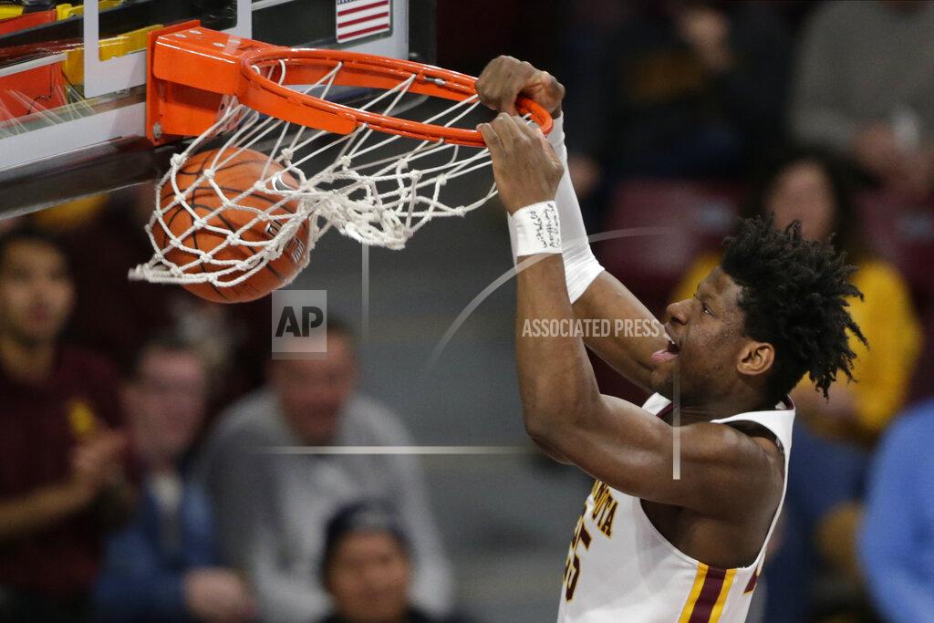Andy Clayton-King Minnesota center Daniel Orturu dunks against Clemson in the first half during an NCAA college basketball game Monday, Dec. 2, 2019, in Minneapolis. (AP Photo/Andy Clayton-King)
