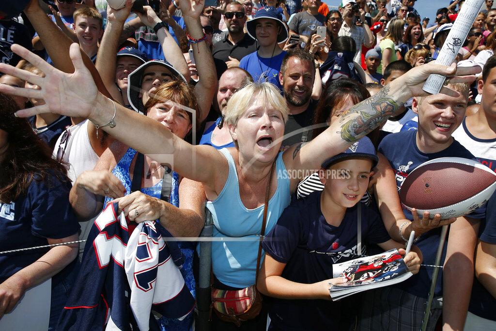 Michael Dwyer FILE - In this July 30, 2016, file photo, fans react to New England Patriots quarterback Tom Brady during an autograph session following an NFL football training camp practice in Foxborough, Mass. Tom Brady is an NFL free agent for the first time in his career. The 42-year-old quarterback with six Super Bowl rings said Tuesday morning, March 17, 2020, that he is leaving the New England Patriots. (AP Photo/Michael Dwyer, File)