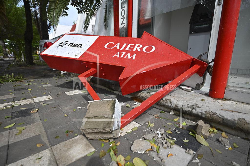Roberto Echeagaray A bank cash machine lays on the ground after the passing of Hurricane Pamela in Mazatlan, Mexico, Wednesday, Oct. 13, 2021. Hurricane Pamela made landfall on Mexico's Pacific coast just north of Mazatlan on Wednesday, bringing high winds and rain to the port city. (AP Photo/Roberto Echeagaray)