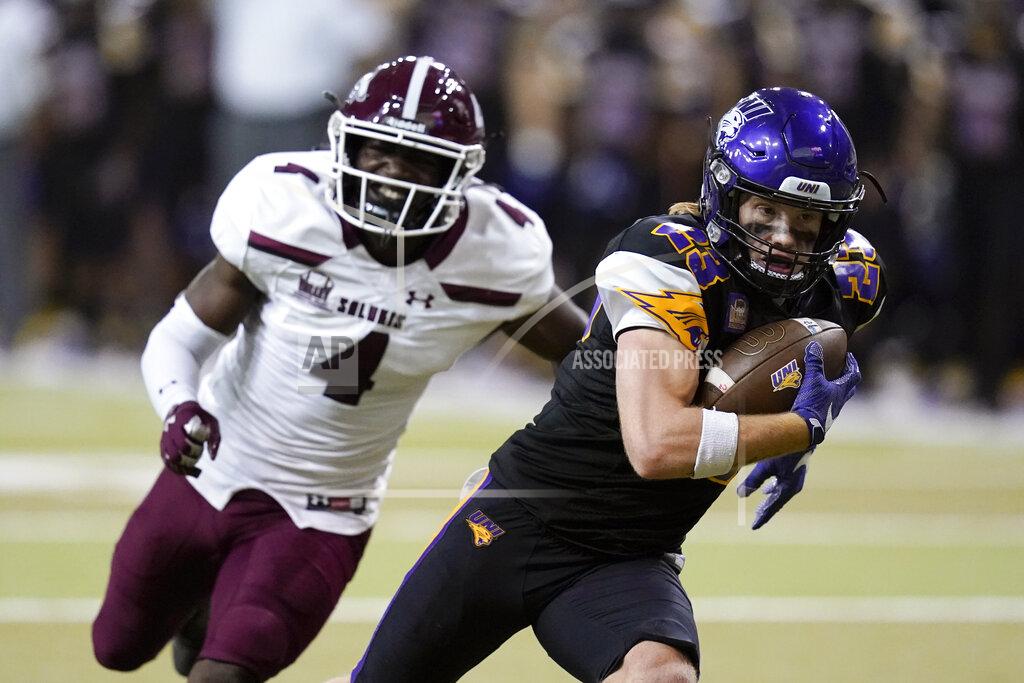 Charlie Neibergall Northern Iowa running back Sam Schnee (23) runs from Southern Illinois cornerback PJ Jules (4) during a 19-yard touchdown reception in the second half of an NCAA college football game, Saturday, Oct. 30, 2021, in Cedar Falls, Iowa. Northern Iowa won 23-16. (AP Photo/Charlie Neibergall)