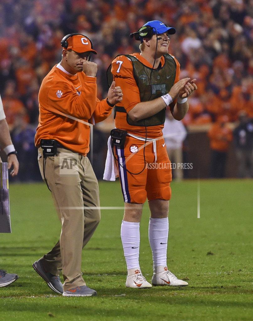 Richard Shiro Clemson head coach Dabo Swinney, left, and quarterback Chase Brice celebrate a touchdown during the first half of an NCAA college football game against South Carolina Saturday, Nov. 24, 2018, in Clemson, S.C. (AP Photo/Richard Shiro)
