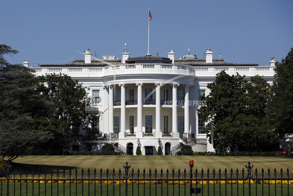 FILE - In this Sept. 25, 2019, file photo, The White House is seen from the Ellipse in Washington. Forty lobbyists with ties to President Donald Trump helped their clients secure over $10 billion in federal coronavirus aid. Among them are five former administration officials whose lobbying work potentially violates an ethics order Trump issued after taking office. (AP Photo/Carolyn Kaster, File)