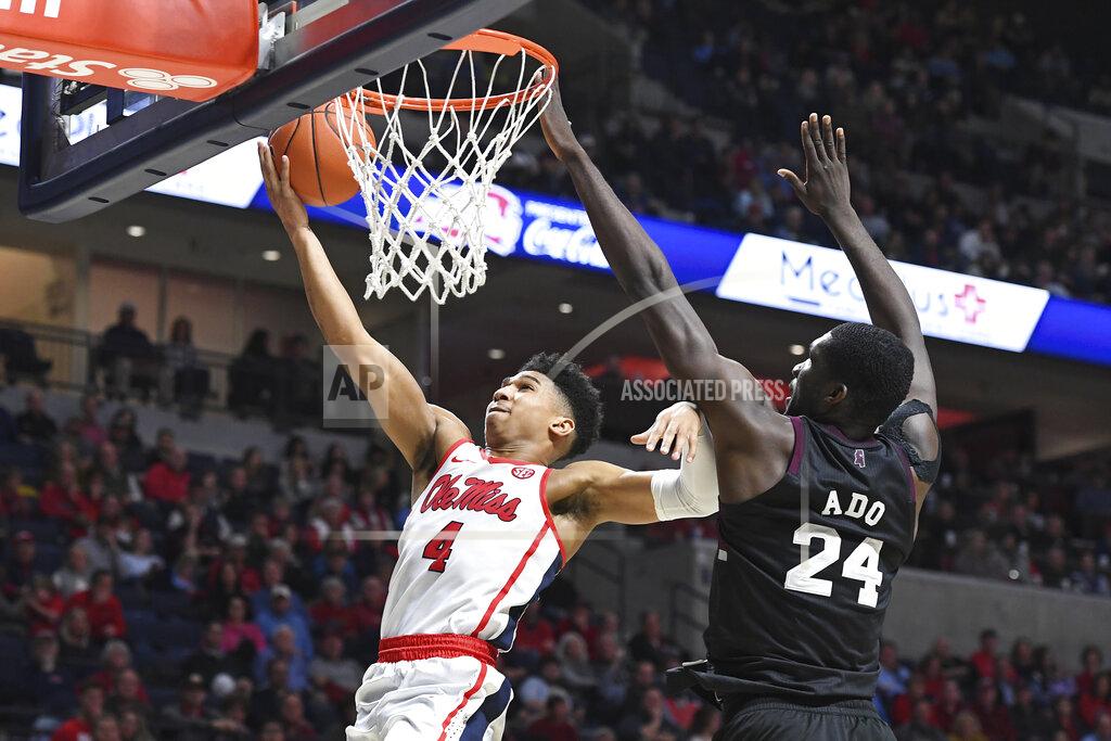 Thomas Graning Mississippi guard Breein Tyree (4) takes a shot past Mississippi State forward Abdul Ado (24) during the second half of an NCAA college basketball game in Oxford, Miss., Tuesday, Feb. 11, 2020. Mississippi won 83-58. (AP Photo/Thomas Graning)