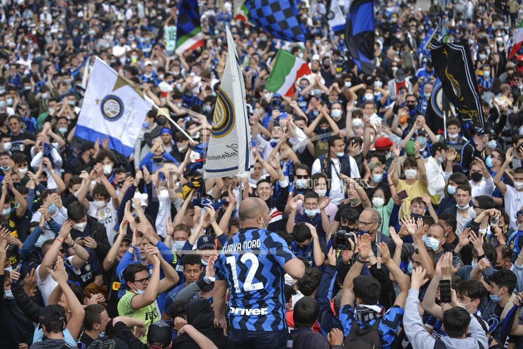 Claudio Furlan Inter Milan fans celebrate in Piazza Duomo square in front of the gothic cathedral after Inter Milan won its first Serie A title in more than a decade after second-placed Atalanta drew 1-1 at Sassuolo, in Milan, Italy, Sunday, May 2, 2021. Atalanta needed to win to avoid Inter mathematically clinching the title with four matches remaining. It was Inter’s first trophy since 2011 and the first Serie A title since 2010. (Claudio Furlan/LaPresse via AP)