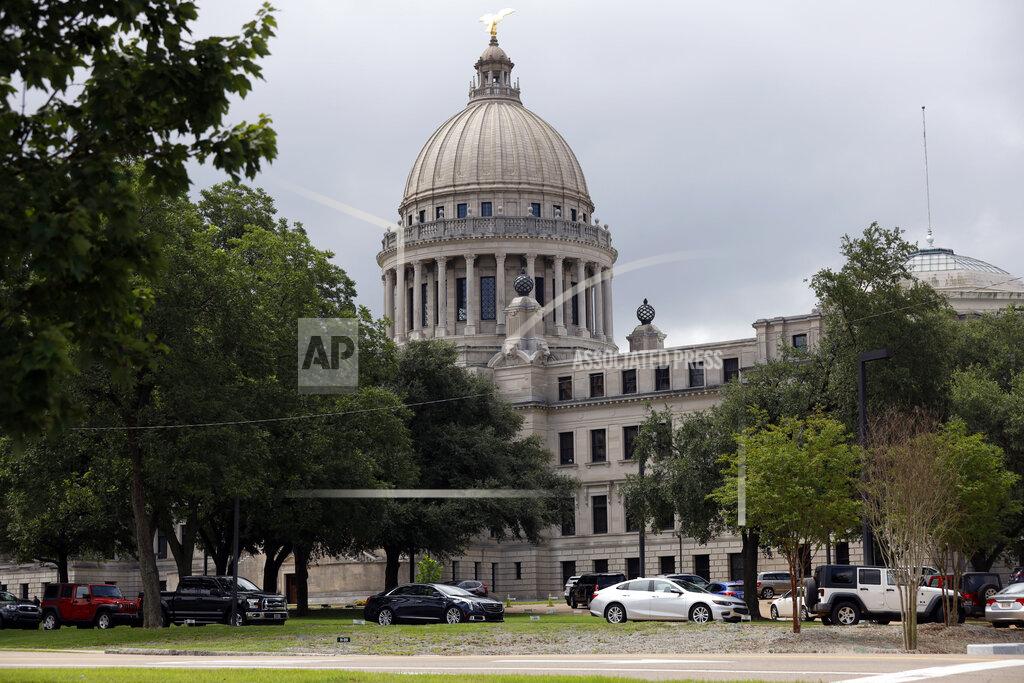 FILE - In this July 6, 2020, file photo, Mississippi legislators, staff and Capitol employees take advantage of a drive-thru COVID-19 testing center on the Capitol grounds in Jackson, Miss. Mississippi is seeing the largest outbreak of COVID-19 among legislators in any state. (AP Photo/Rogelio V. Solis, File)