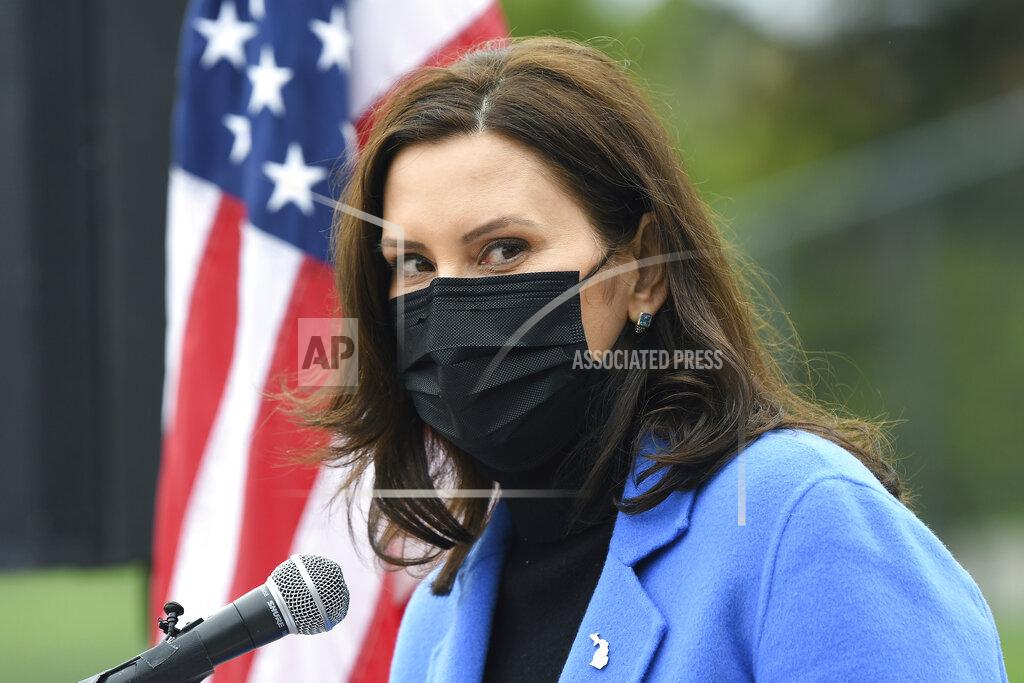 Michigan Governor Gretchen Whitmer U.S. talks about the statewide COVID-19 vaccination effort during a press conference outside the Eastern Michigan University Convocation Center, which was hosting a vaccination clinic, Monday, April 12, 2021, in Ypsilanti, Mich. (Lon Horwedel/Detroit News via AP)
