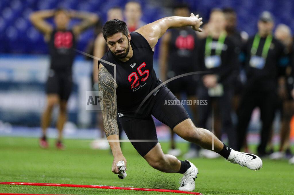 Michael Conroy Iowa defensive lineman A.J. Epenesa runs a drill at the NFL football scouting combine in Indianapolis, Saturday, Feb. 29, 2020. (AP Photo/Michael Conroy)