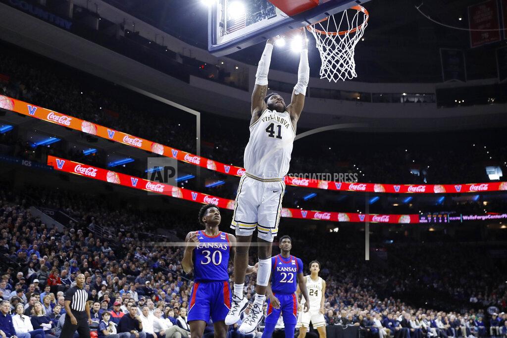 Matt Slocum Villanova's Saddiq Bey (41) goes up for a dunk past Kansas's Ochai Agbaji (30) during the first half of an NCAA college basketball game, Saturday, Dec. 21, 2019, in Philadelphia. (AP Photo/Matt Slocum)