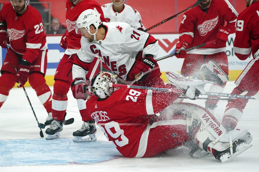 Paul Sancya Carolina Hurricanes right wing Nino Niederreiter (21) scores on Detroit Red Wings goaltender Thomas Greiss (29) in the first period of an NHL hockey game Thursday, Jan. 14, 2021, in Detroit. (AP Photo/Paul Sancya)