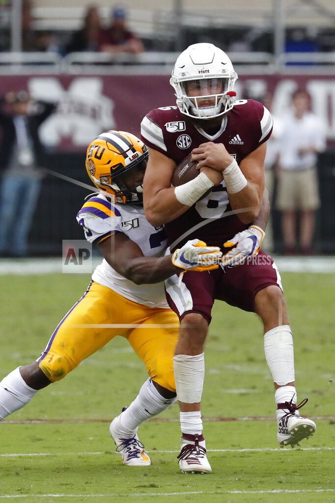 Mississippi State quarterback Garrett Shrader (6) is tackled by LSU safety JaCoby Stevens (3) after a short run during the second half of their NCAA college football game in Starkville, Miss., Saturday, Oct. 19, 2019. LSU won 36-13. (AP Photo/Rogelio V. Solis)