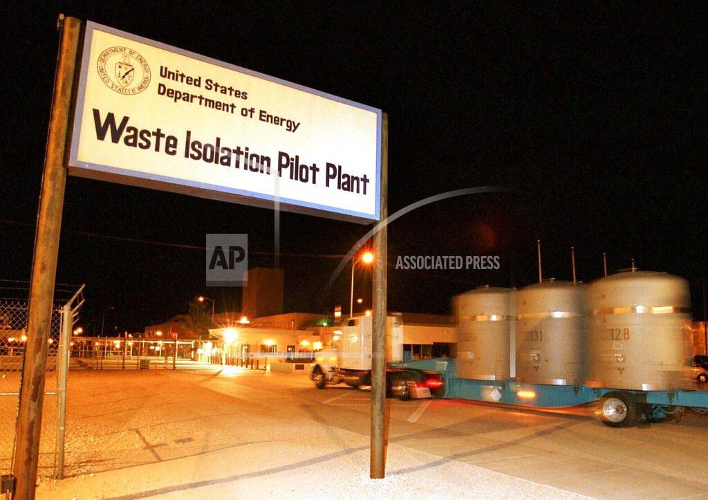 Thomas Herbert FILE - In this March 1999, file photo, the first load of nuclear waste arrives at the Waste Isolation Pilot Plant site in Carlsbad, N.M., from Los Alamos National Laboratory. Managers of the federal government's underground nuclear waste repository in southern New Mexico say operations are ongoing despite a recent increase in COVID-19 cases among workers. The Carlsbad Current-Argus reports that the Waste Isolation Pilot Plant has seen cases among employees and contract workers more than double in the last week. (AP Photo/Thomas Herbert, File)