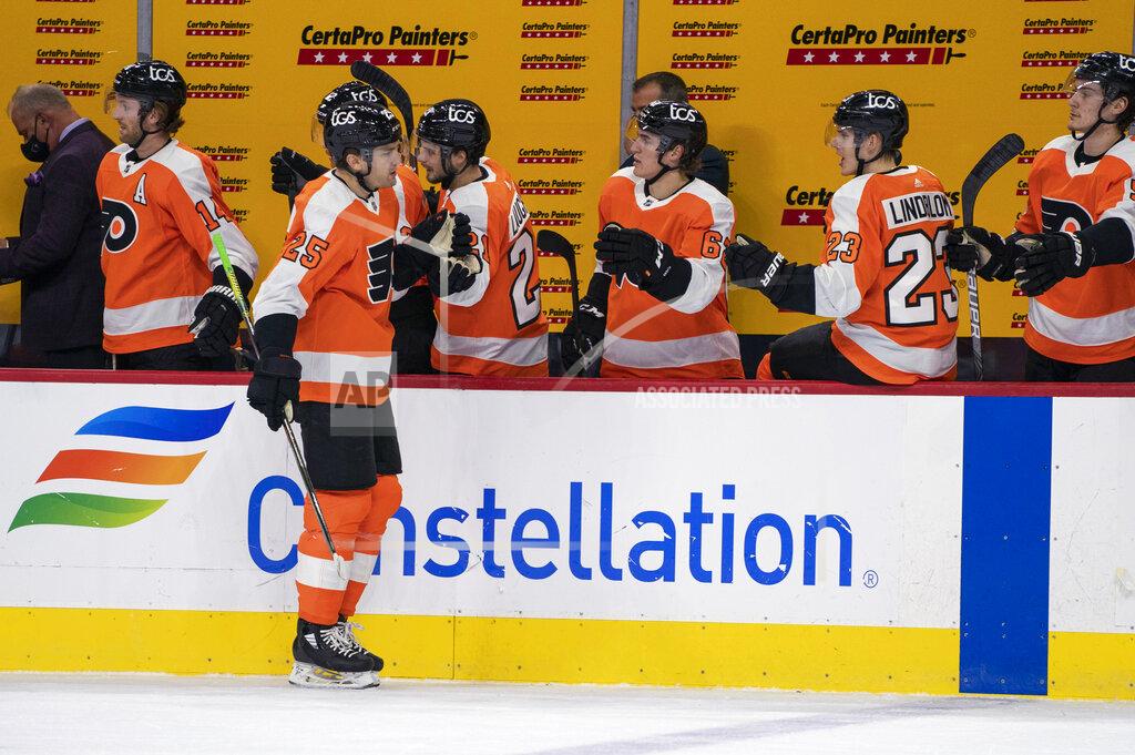Philadelphia Flyers' James van Riemsdyk celebrates his goal with teammates during the first period of an NHL hockey game against the Pittsburgh Penguins, Wednesday, Jan. 13, 2021, in Philadelphia. (AP Photo/Chris Szagola)
