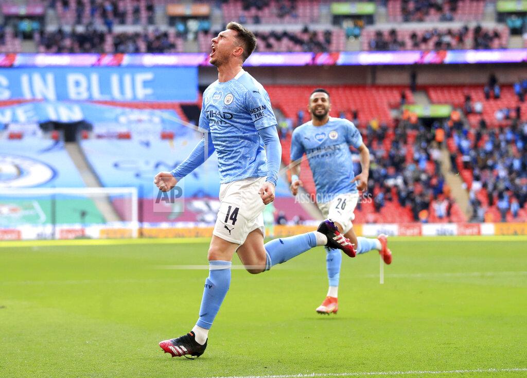 Adam Davy Manchester City's Aymeric Laporte celebrates scoring their side's first goal of the game during the English League Cup Cup Final against Tottenham Hotspur at Wembley Stadium, London, Sunday April 25, 2021. (Adam Davy/PA via AP)
