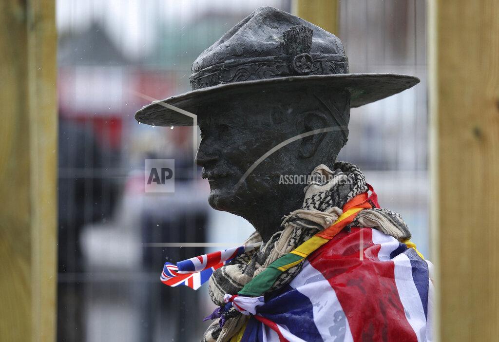 Peter Byrne The statue of the Scouting Movement Robert Baden-Powell is boarded up by the local council, in Poole Quay, England, Friday June 12, 2020. The council has announced that the statue of Baden-Powell would be temporarily taken down as it is believed to be a target for protests. In the UK the Black Lives Matter movement has prompted a wider debate about issues relating to Britain's colonial past and historical figures. (Peter Byrne/PA via AP)