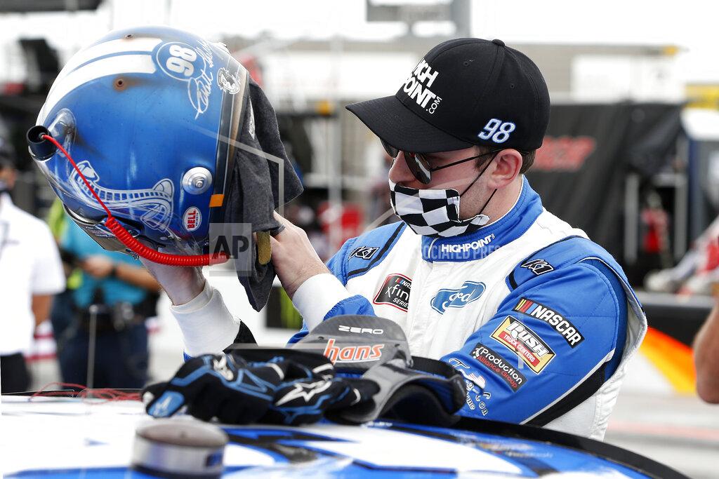 Ralph Freso Chase Briscoe looks over his helmet prior to the NASCAR Xfinity Series auto race at Phoenix Raceway, Saturday, Nov. 7, 2020, in Avondale, Ariz. (AP Photo/Ralph Freso)