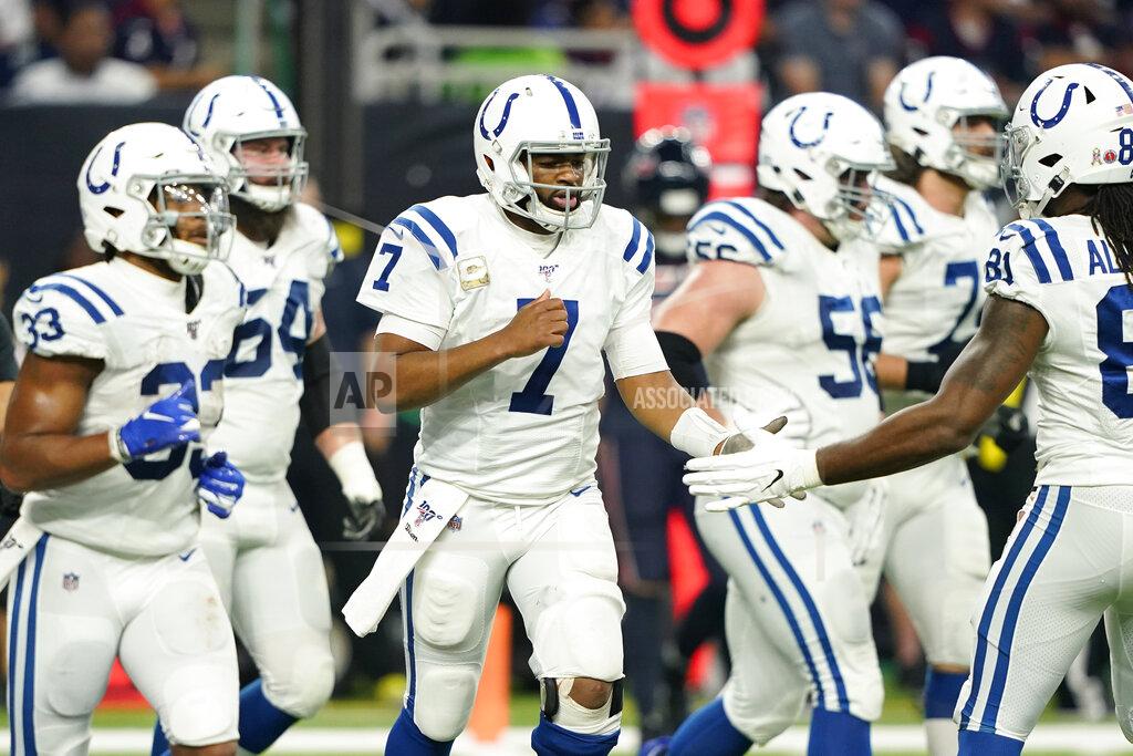 David J. Phillip Indianapolis Colts quarterback Jacoby Brissett (7) celebrates with teammates after a touchdown against the Houston Texans during the first half of an NFL football game Thursday, Nov. 21, 2019, in Houston. (AP Photo/David J. Phillip)