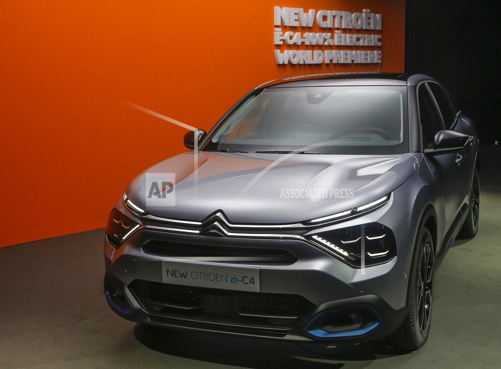Michel Euler The Citroen e-C4 all electric hatchback is display during a media presentation in Paris, Tuesday, June 30, 2020. PSA Group's Citroen Brand is showing off a new version of its C4 compact hatchback, a model that will be key to the company's sales prospects as it faces a highly competitive European car market that faces severe headwinds from the coronavirus. (AP Photo/Michel Euler)