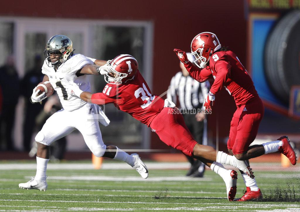 Darron Cummings Purdue's D.J. Knox (1) runs past Indiana's Bryant Fitzgerald (31) and Jonathan Crawford (9) during the second half of an NCAA college football game, Saturday, Nov. 24, 2018, in Bloomington, Ind. Purdue won 28-21. (AP Photo/Darron Cummings)