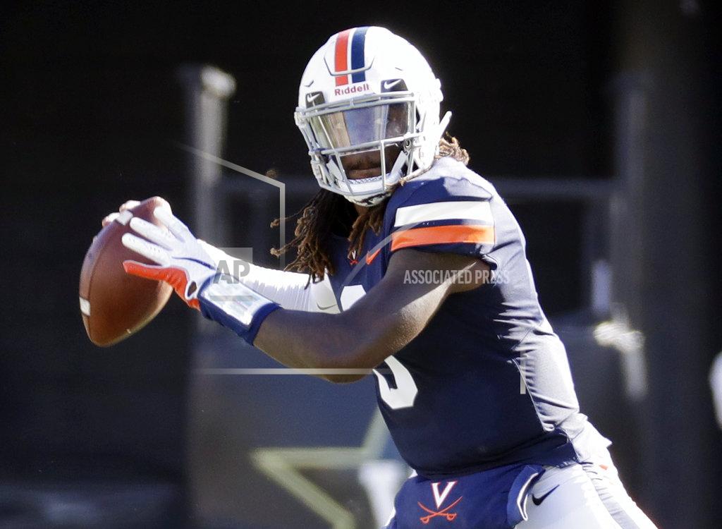 Mark Humphrey Virginia quarterback Bryce Perkins passes against Ohio in the first half of an NCAA college football game Saturday, Sept. 15, 2018, in Nashville, Tenn. (AP Photo/Mark Humphrey)